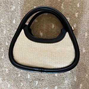 Chic rattan and black leather top handle purse!